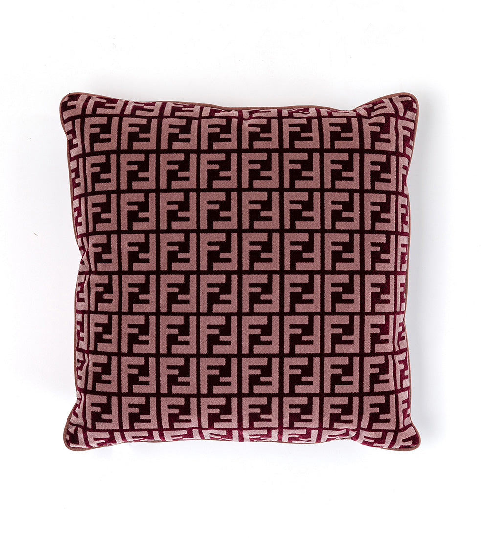 FF logo cushion in aubergine velour on white background, showcasing luxury design and iconic patterned furniture Fendi Casa