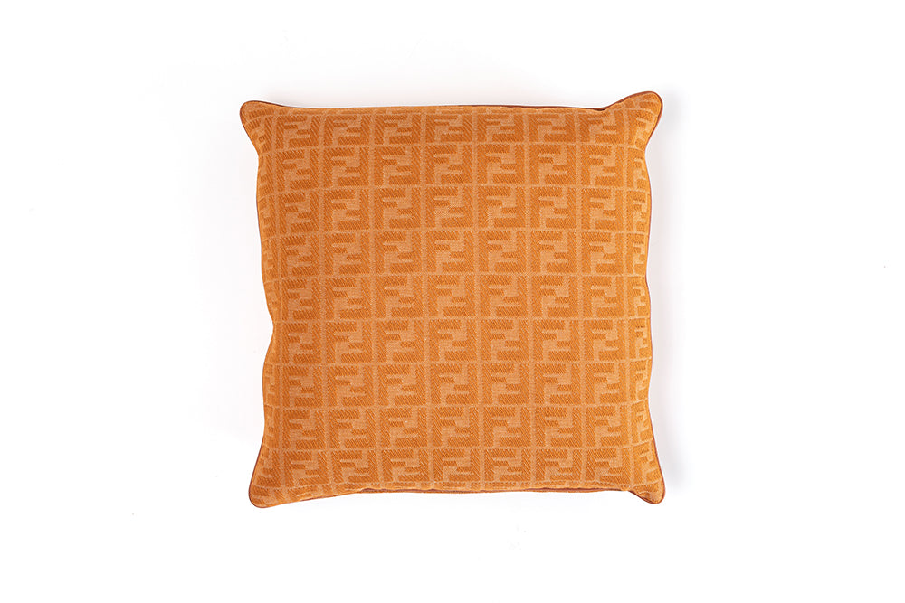 FF logo patterned cushion in orange fabric, showcasing luxury design iconic furniture Fendi Casa