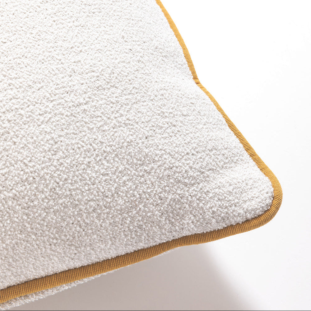 Close-up of luxury bouclé cushion texture with refined piping, premium Italian design furniture detail Fendi Casa