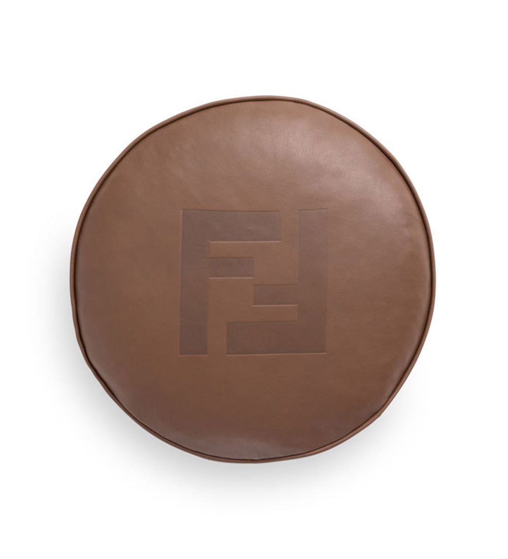 Round leather cushion in warm brown tone with embossed FF logo, luxury furniture accessory with refined design – Fendi Casa