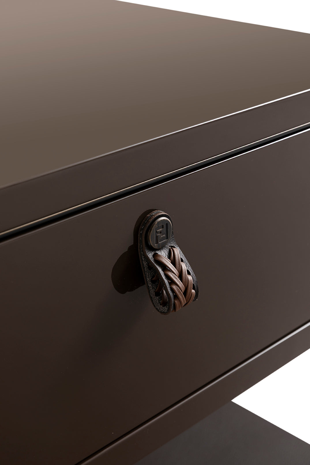 Luxury design detail of a bedside table drawer with braided leather handle, refined furniture craftsmanship, Fendi Casa