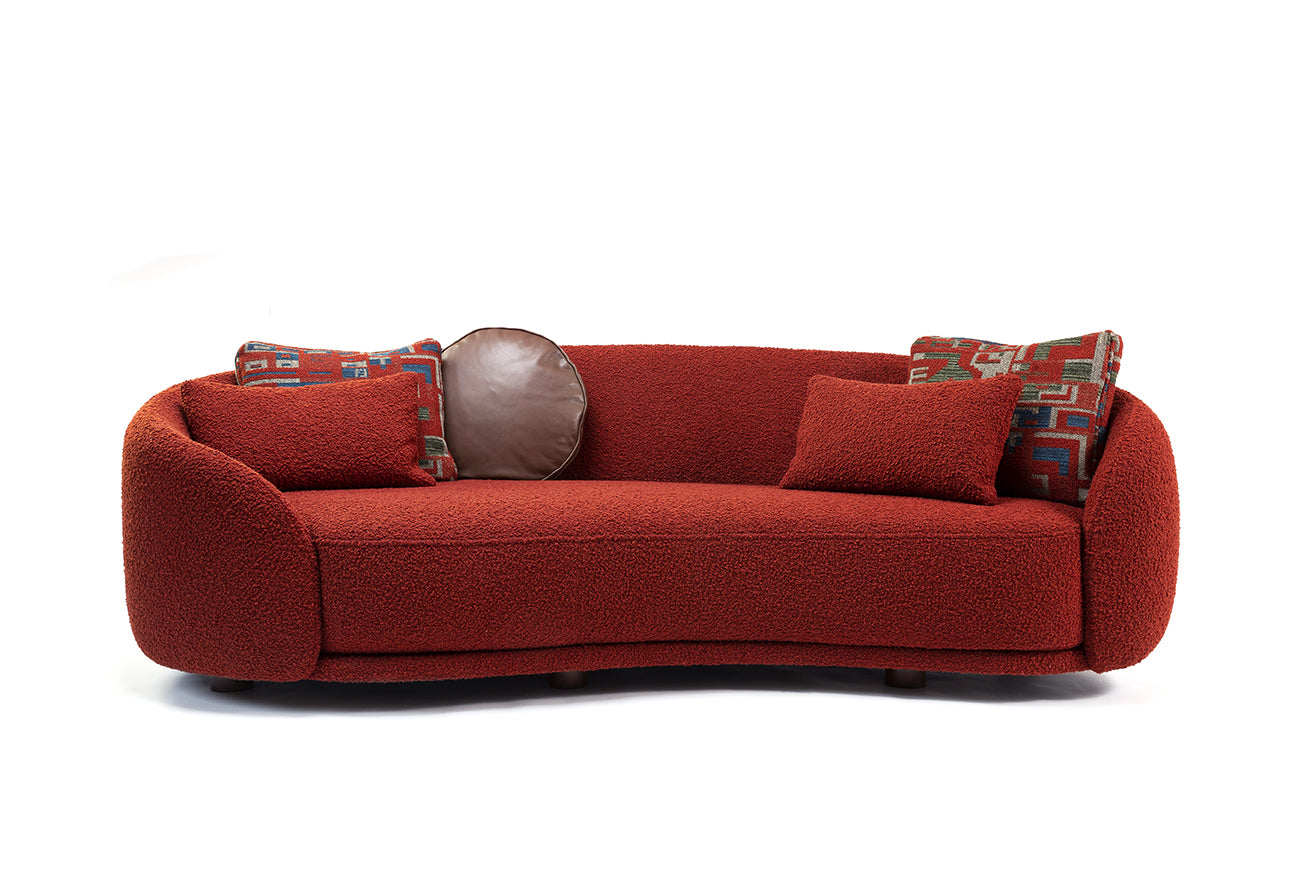 Luxury curved sofa with bold upholstery and decorative cushions, contemporary design furniture Fendi Casa
